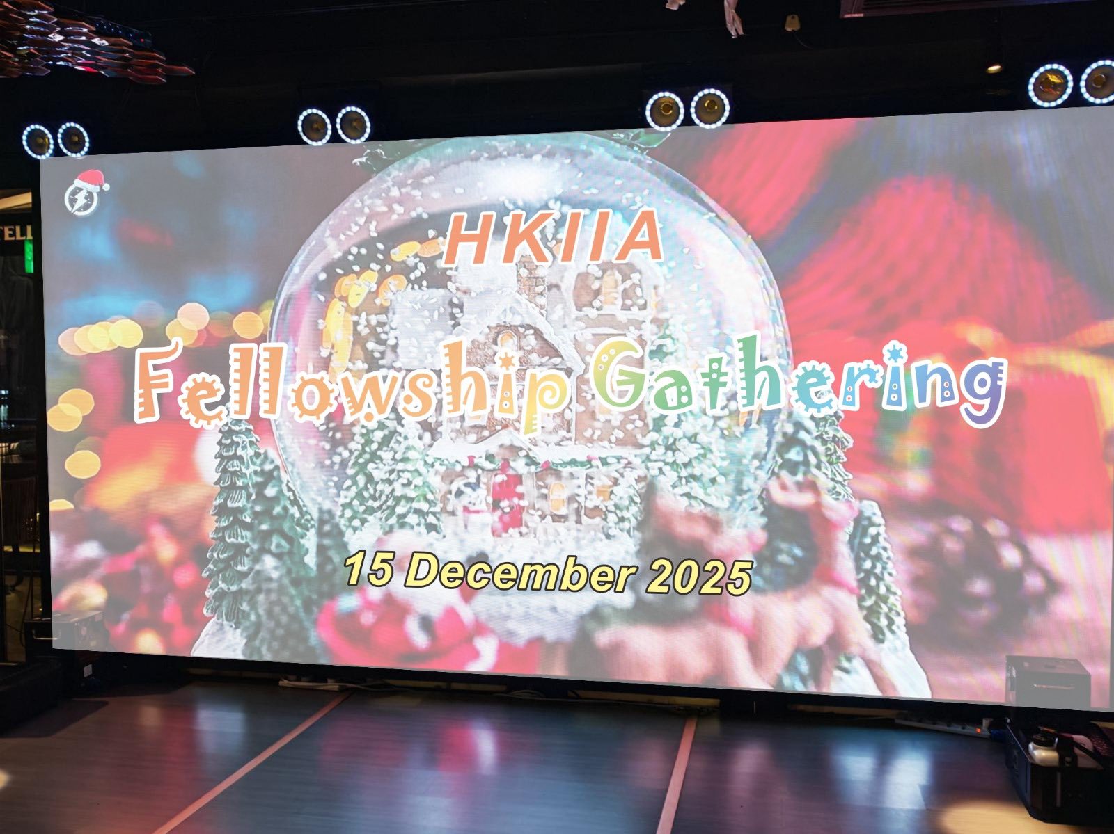 可能是包含下列内容的图片：电视和上面的文字是“oO HKIIA Fell Fellowship lowship.Gathering hering 15 December 2025”